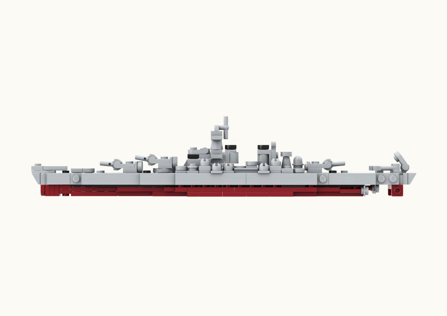 Model of a battleship made from interlocking bricks on a white background