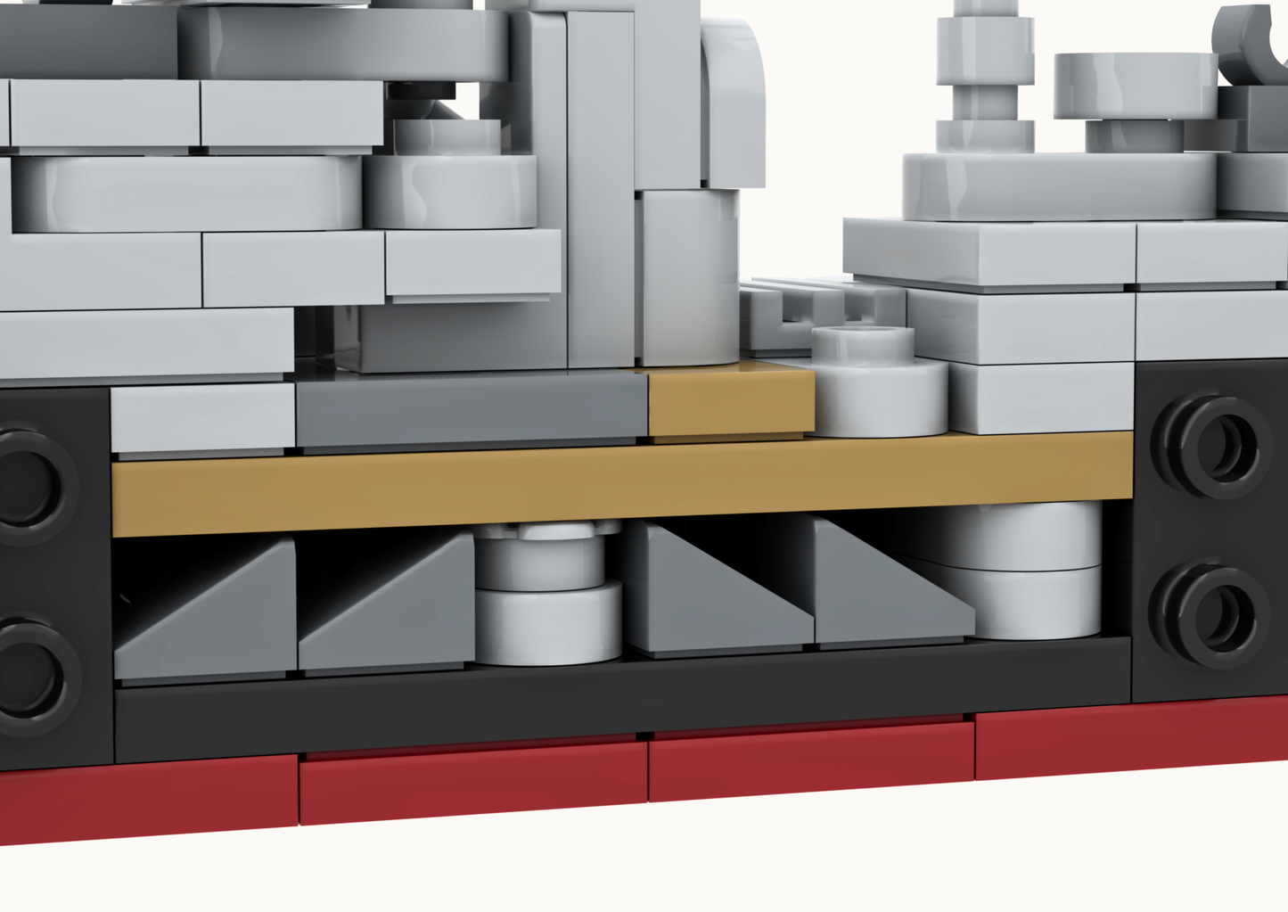 Close-up of a LEGO structure with gray, black, and red bricks.