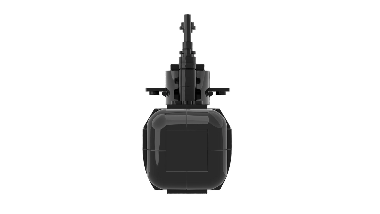 Black toy submarine model on a white background
