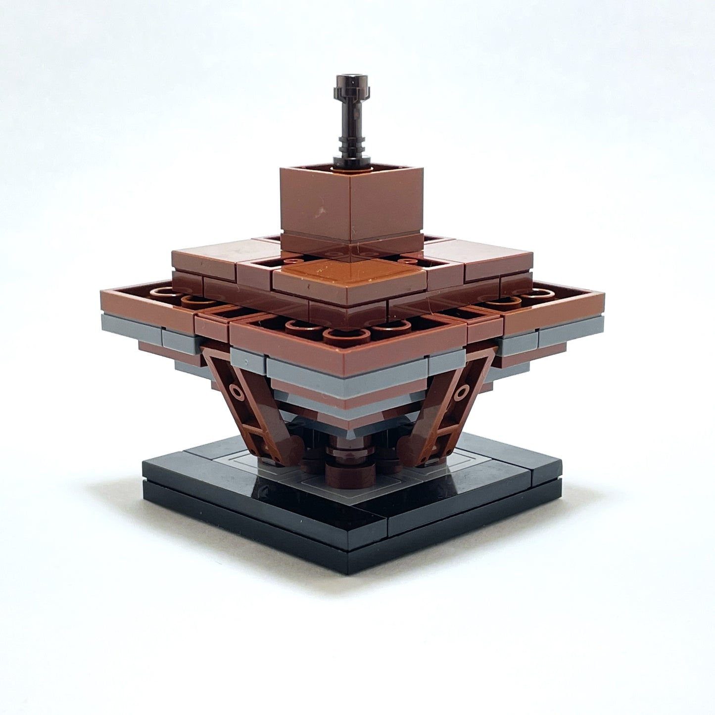 LEGO structure with brown and gray bricks on a white background.