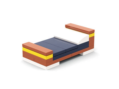 Toy bed with brown, blue, and yellow blocks on a white background