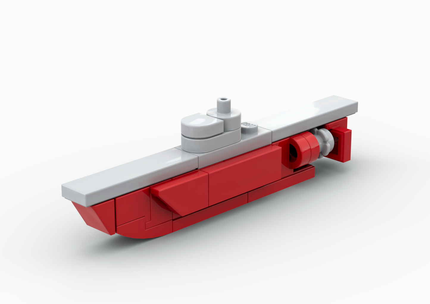 Red and gray toy submarine model on a white background