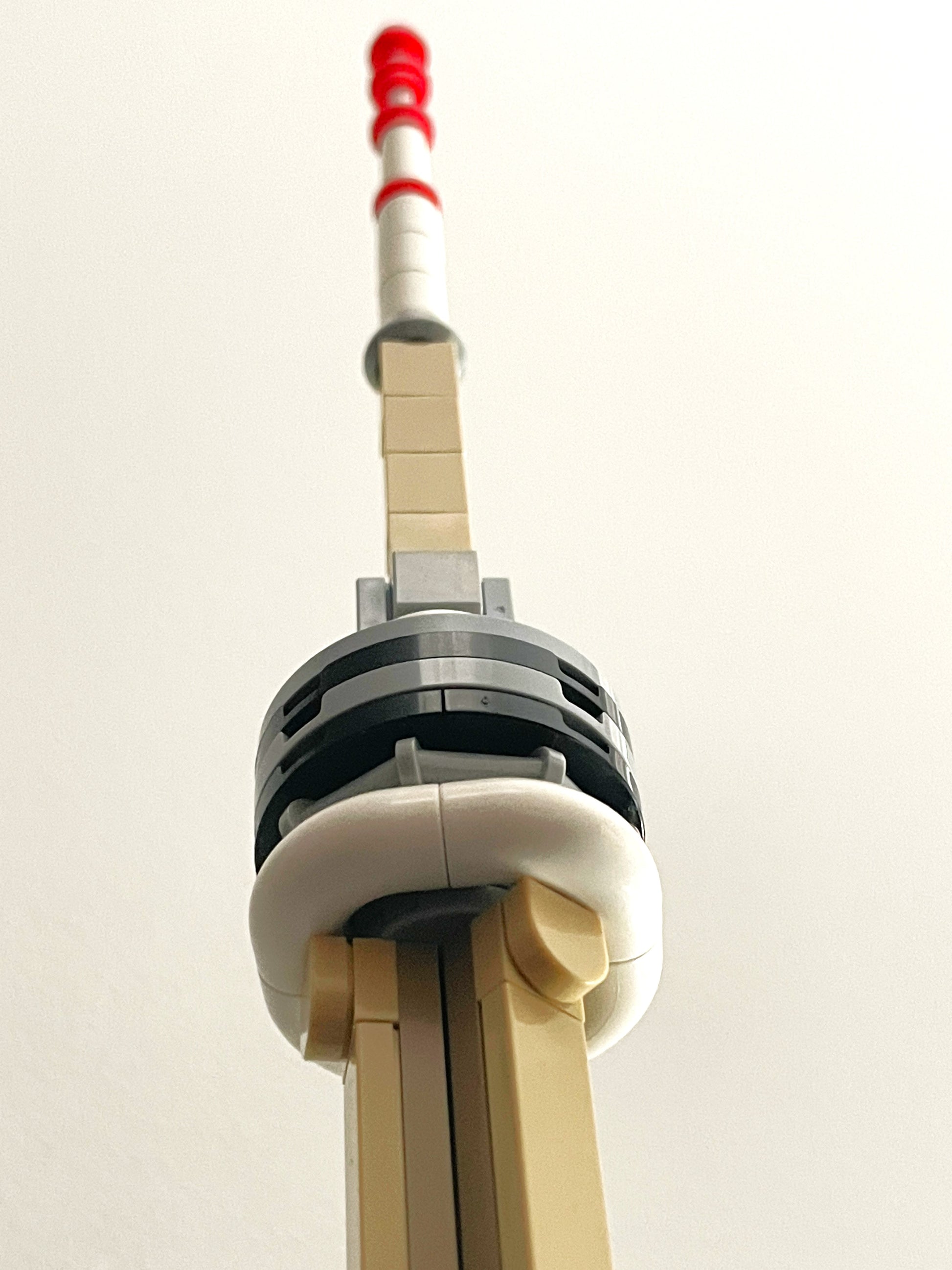 Model of the CN Tower made from building blocks on a white background