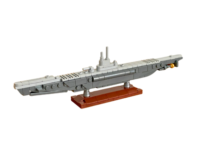 Model of a submarine made from building blocks on a white background
