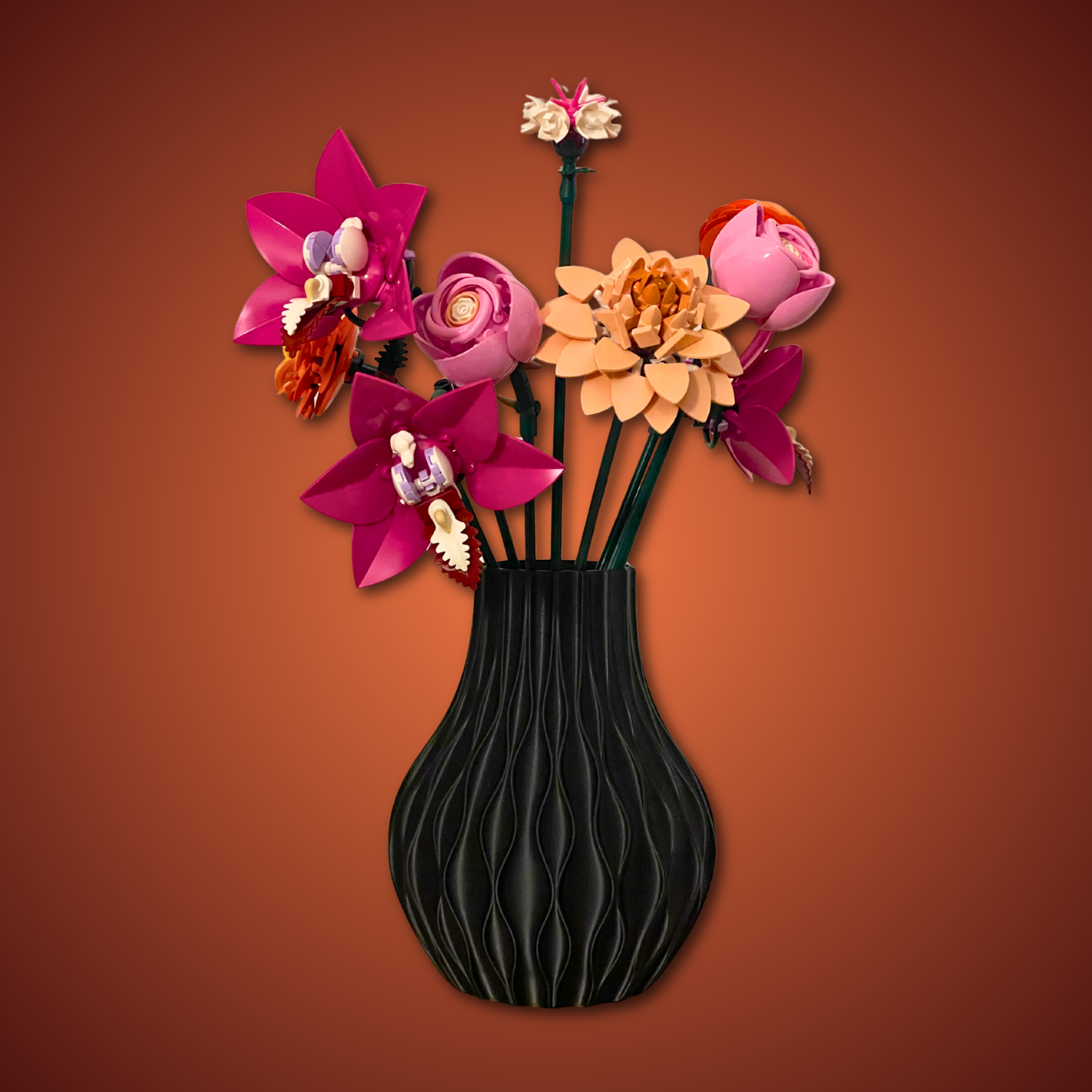 Black vase with colorful flowers on a brown background
