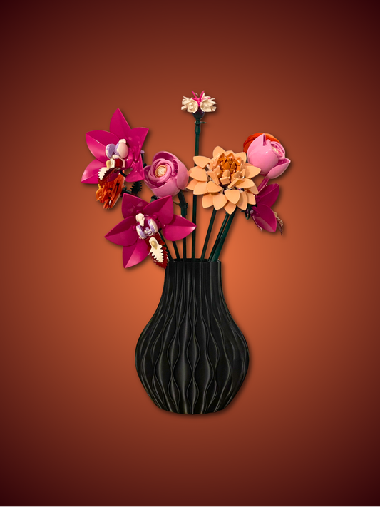 Black vase with colorful flowers on a brown background