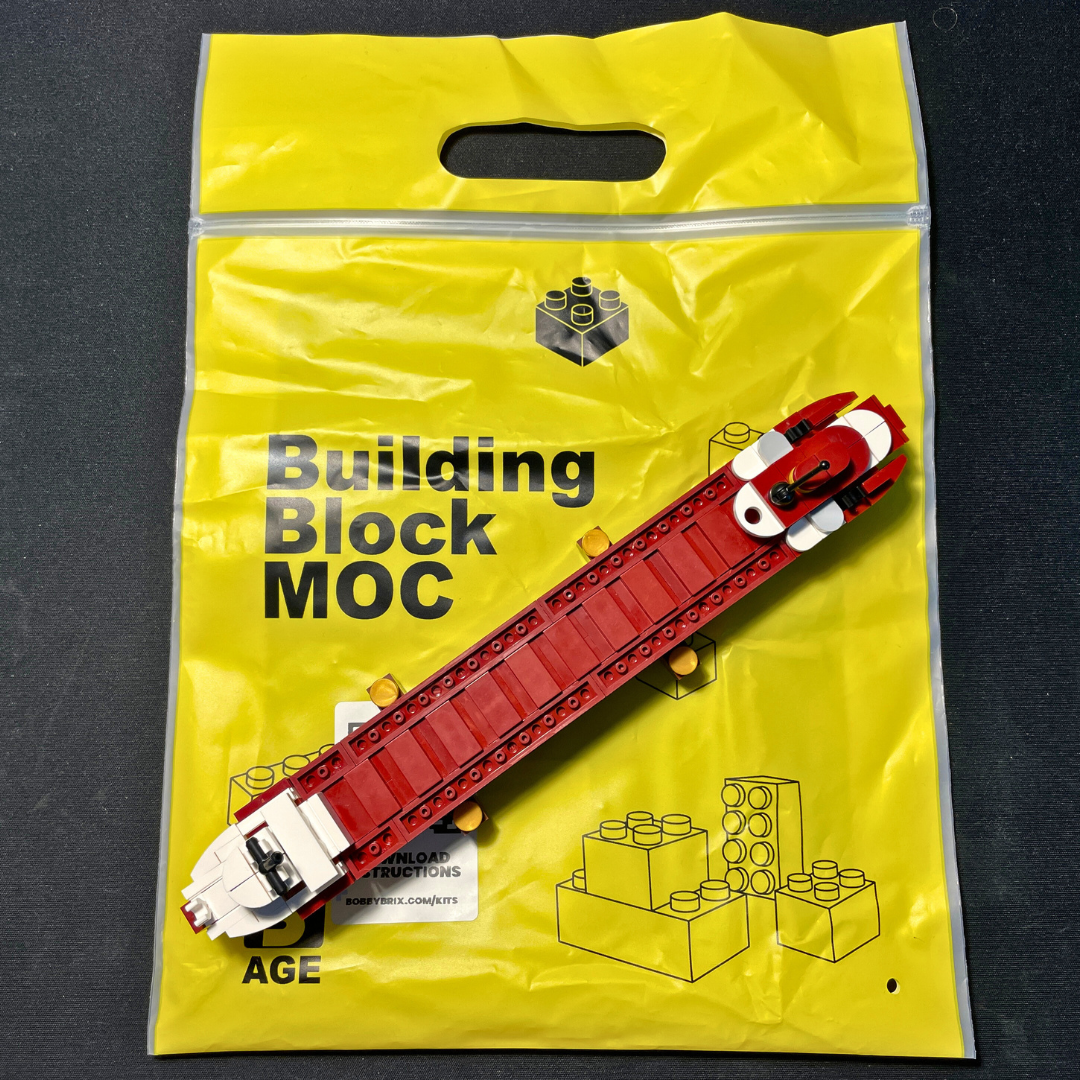 Top view image of the SS Edmund Fitzgerald MOC compared to it's packaging bag.