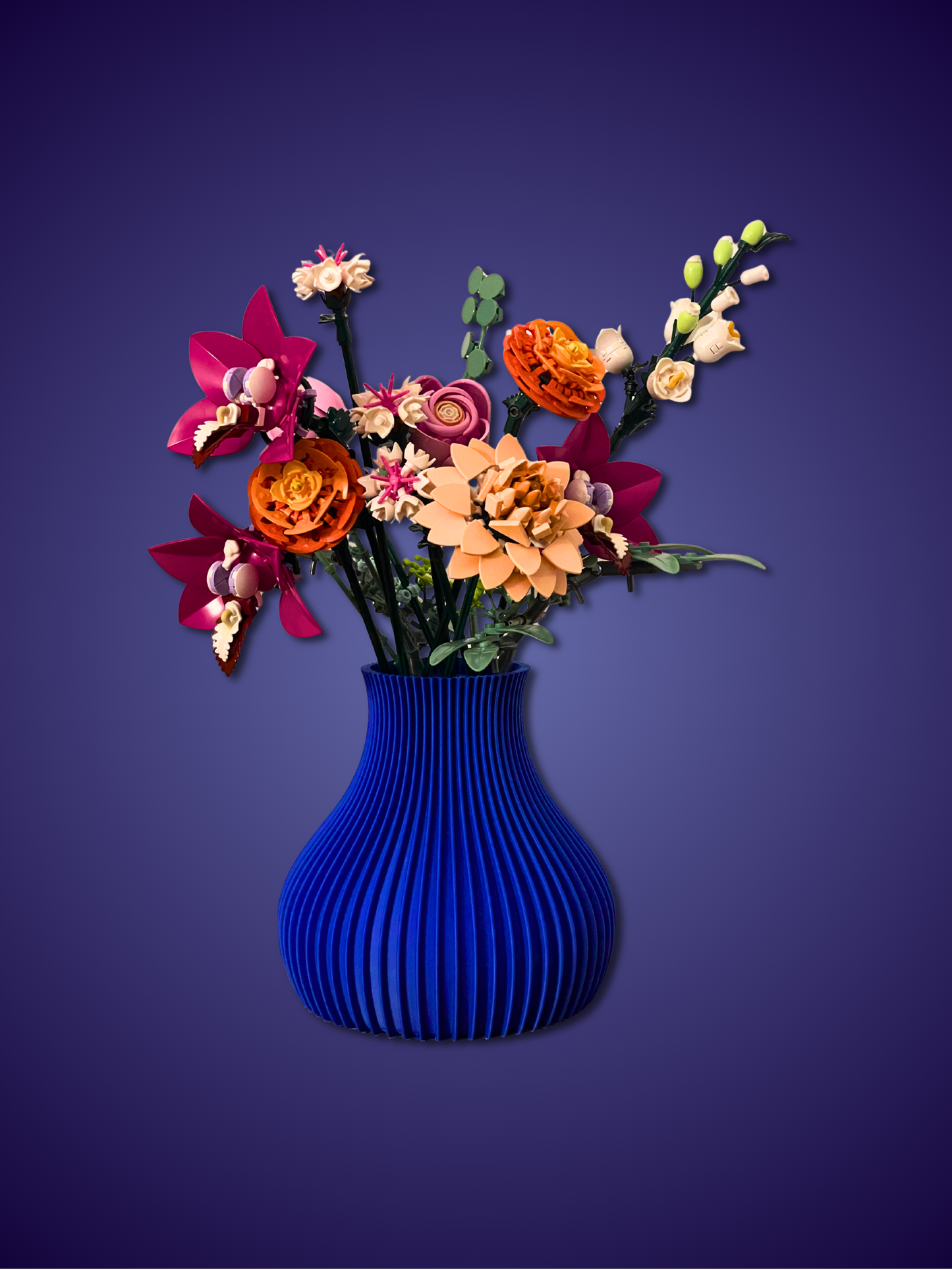 Colorful flowers in a blue vase against a purple background